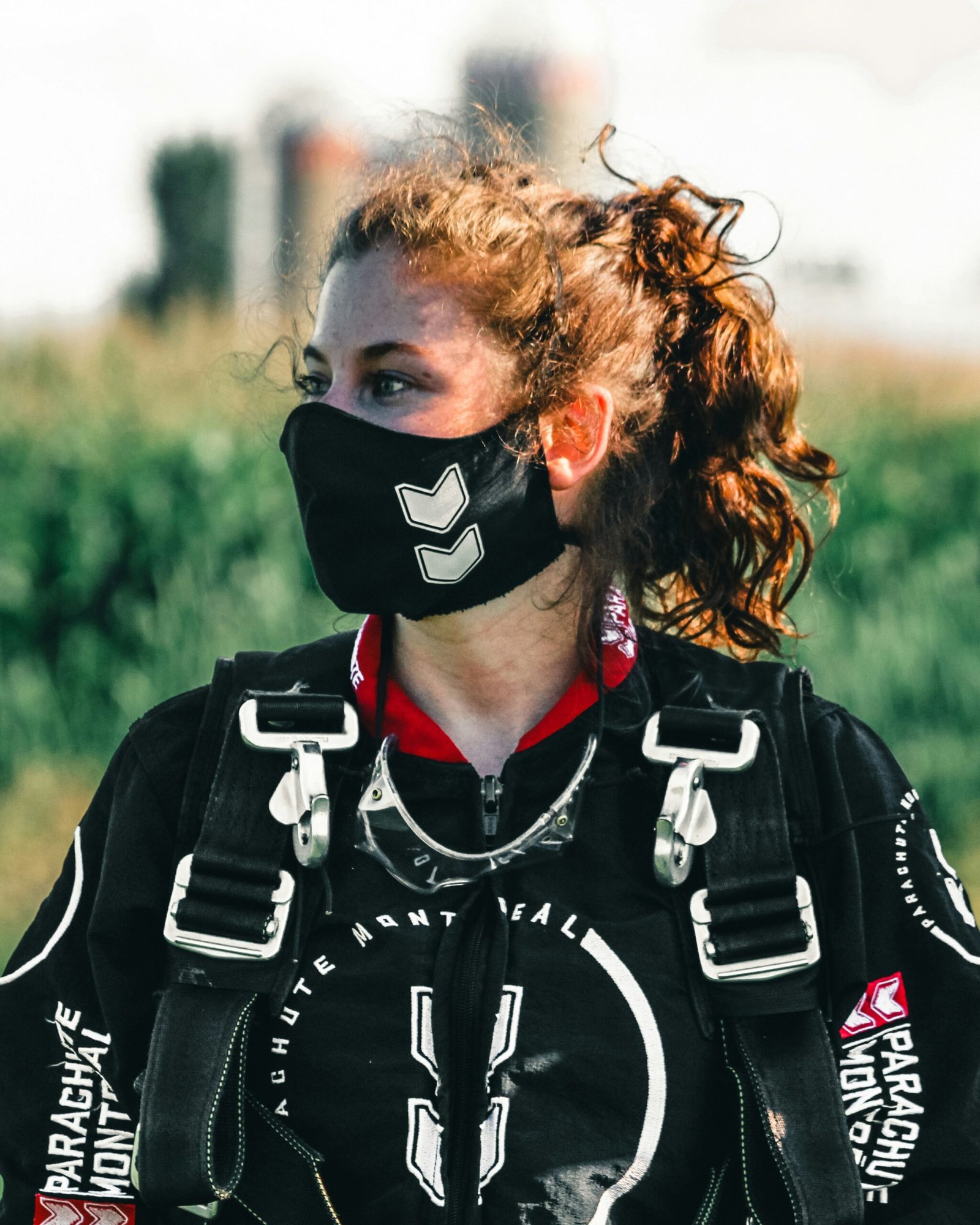 woman in black and white leather jacket wearing black and white mask